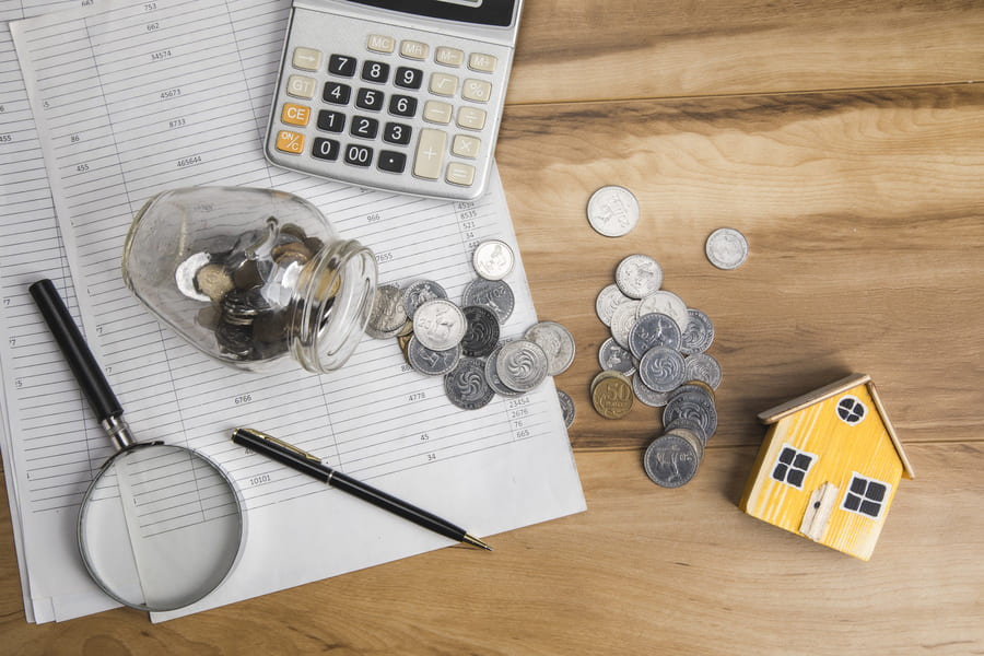 Desk with spilled quarters and other props